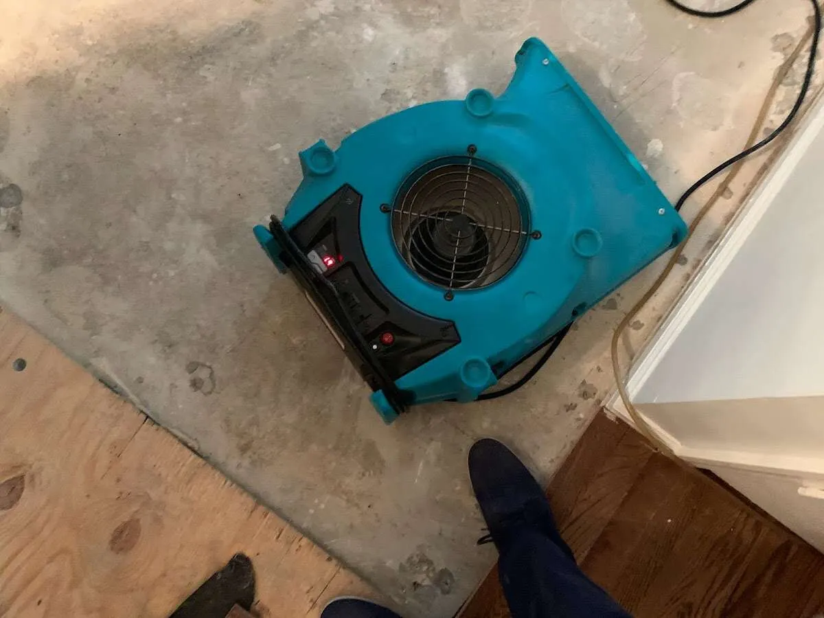 Air mover drying subfloor during Leak Detection & Repair in Prescott
